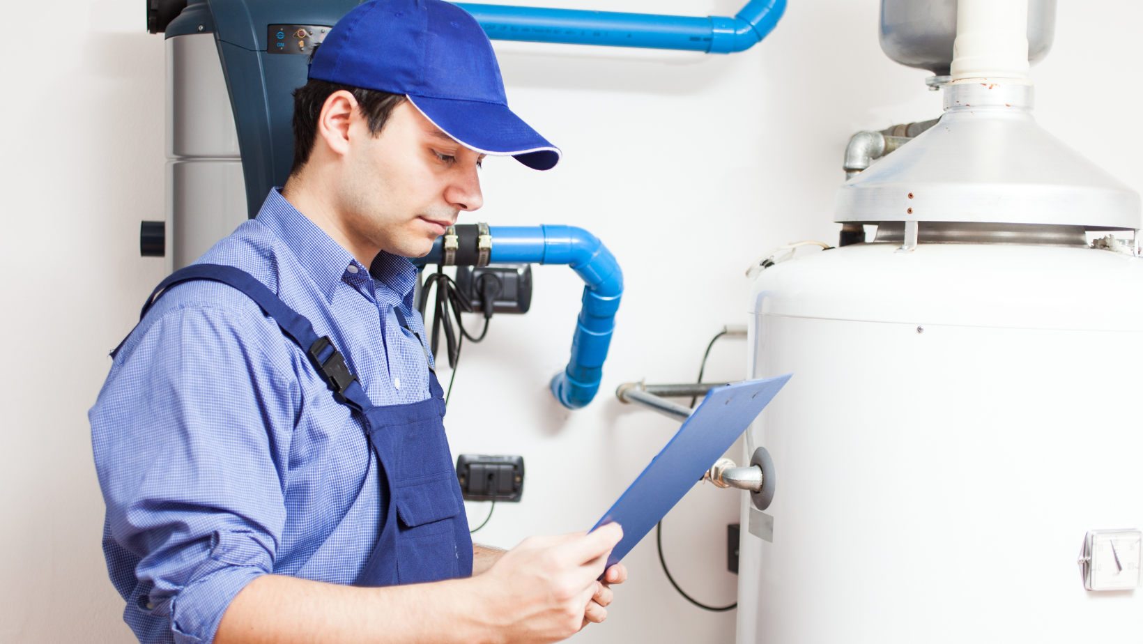 Worker checking water heater